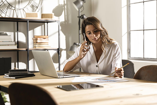 rra-jug-mid-shot-woman-talking-phone-table